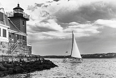 Sailboat Passes Tower of Rockland Breakwater Light -BW